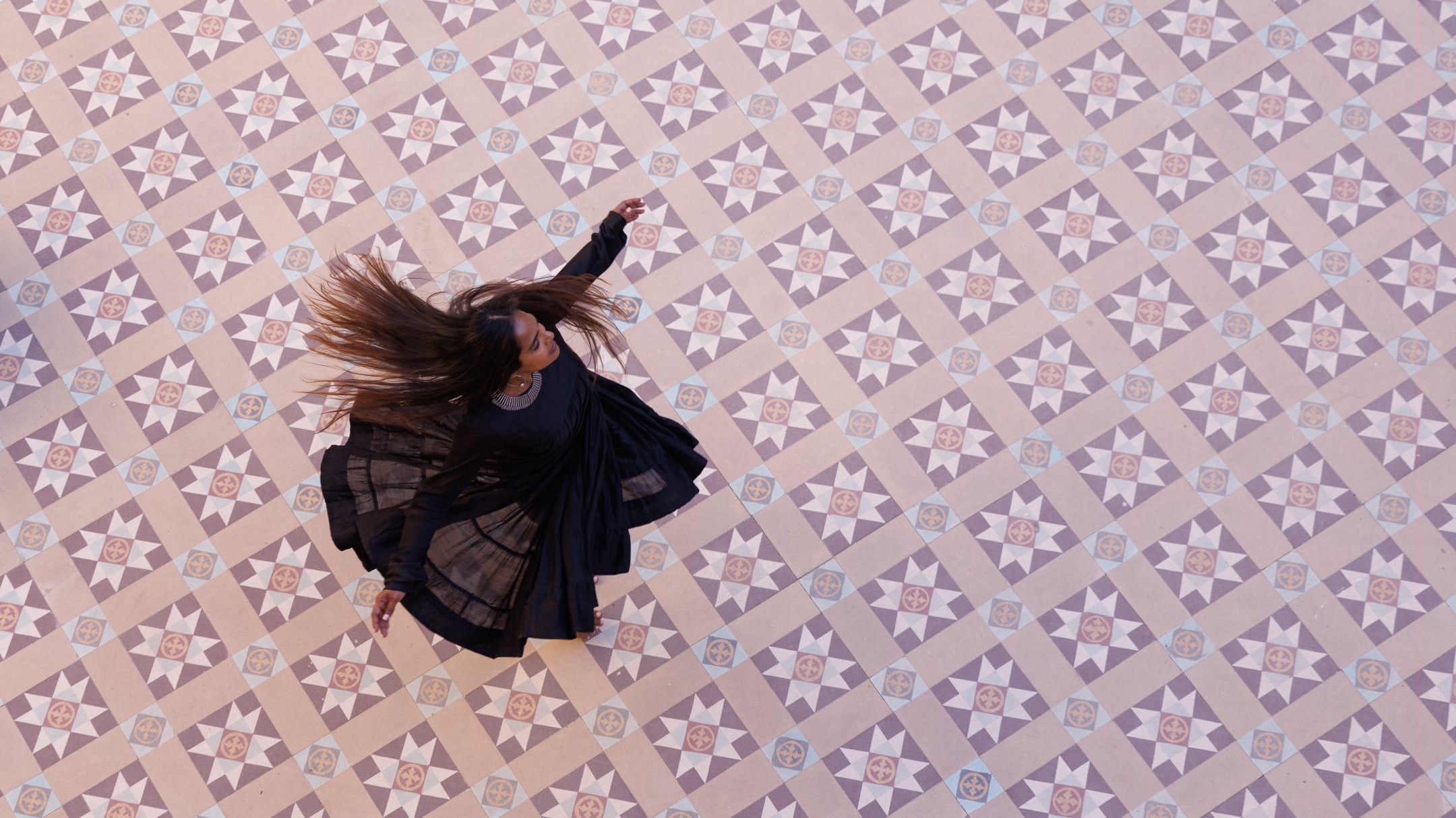 Woman dancing on tiled floor