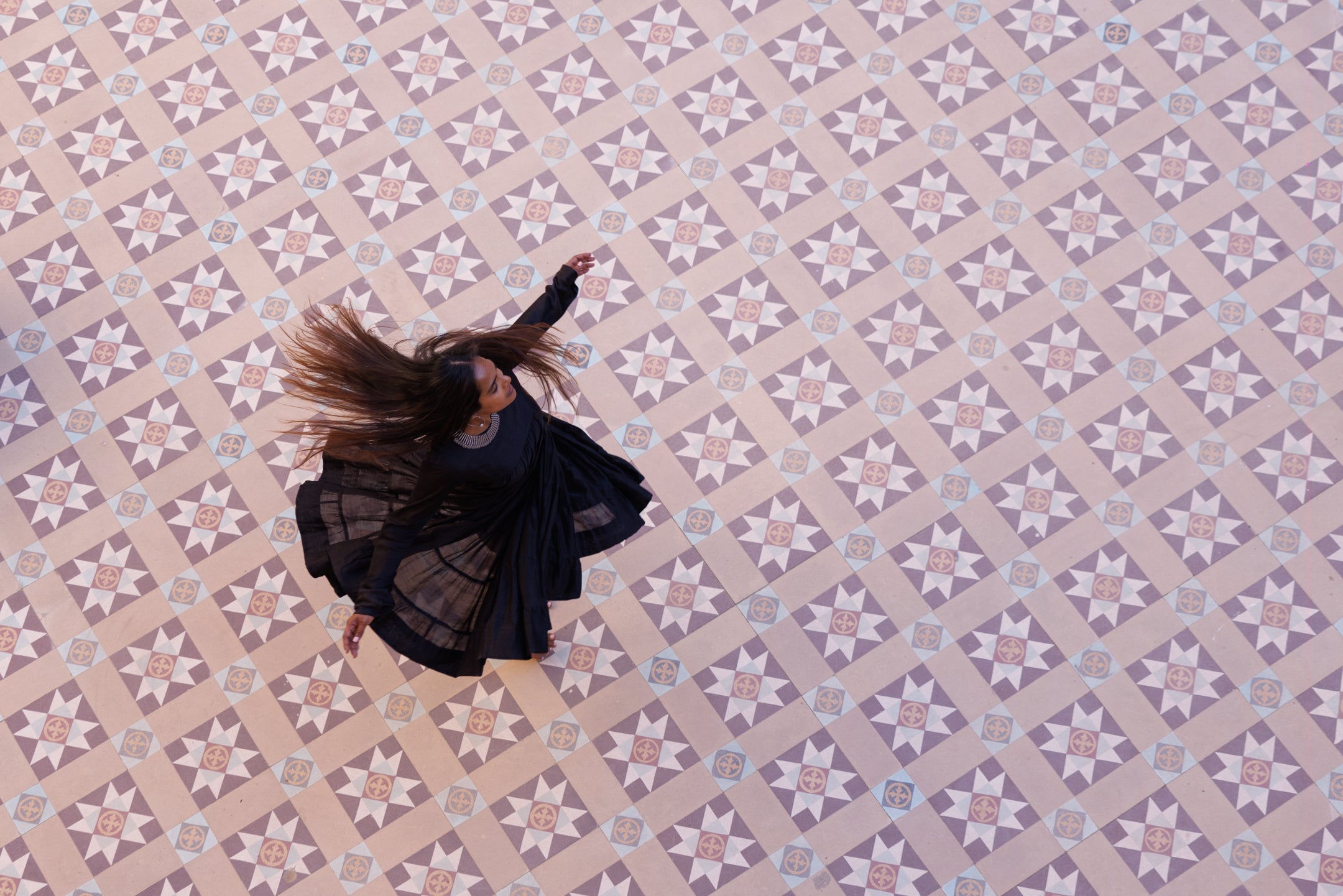 Woman dancing on tiled floor